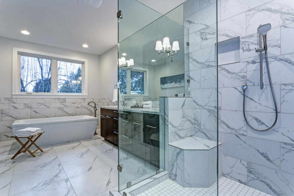 Frameless Shower Doors in a Marble Master Bathroom | Custom Glass Shower Doors